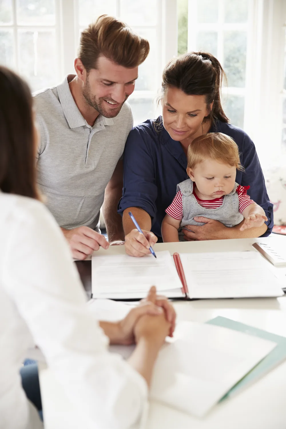 A family reviewing their plan with an advisor